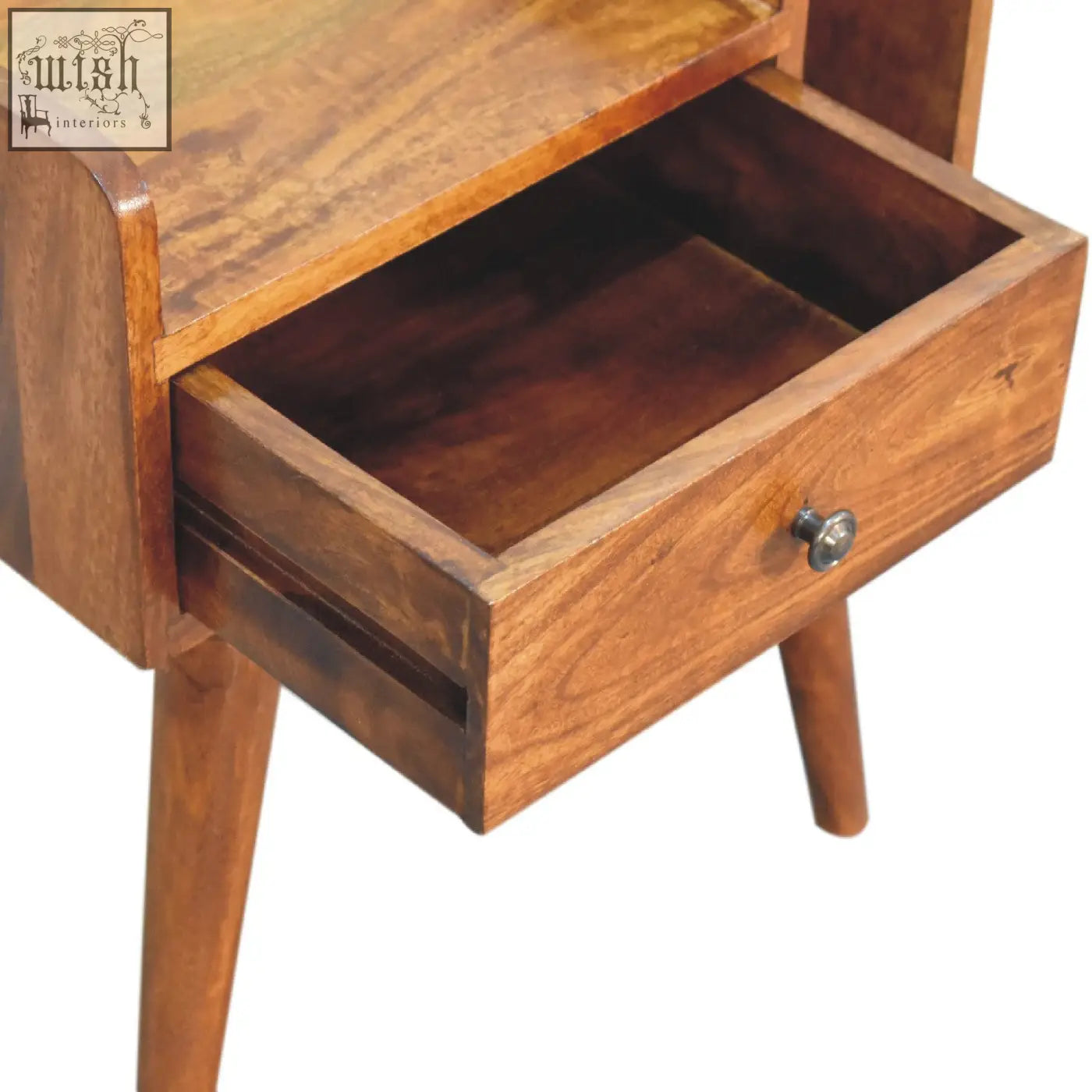 A warm-toned chestnut collective bedside table with a polished finish, small drawer, and tapered legs