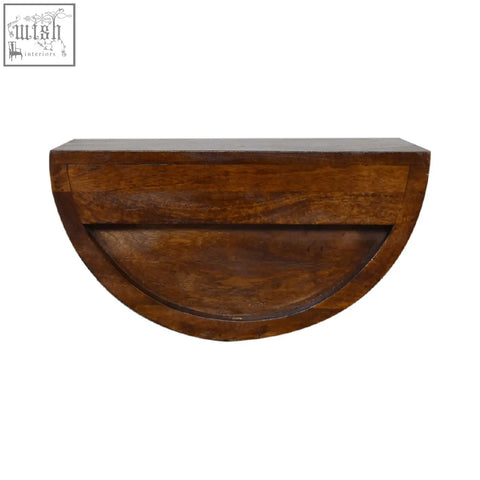 Half-moon shaped chestnut crescent floating bedside table with warm brown wood grain finish and wall-mounted design