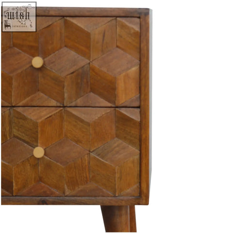 A rustic chestnut cube carved bedside table with geometric drawer fronts and light wood knobs for bedroom use
