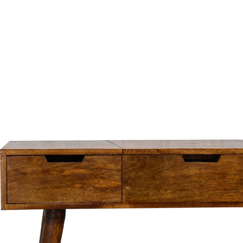 A warm medium-brown mango wood console table with two drawers and tapered legs for a foldable mirror setup