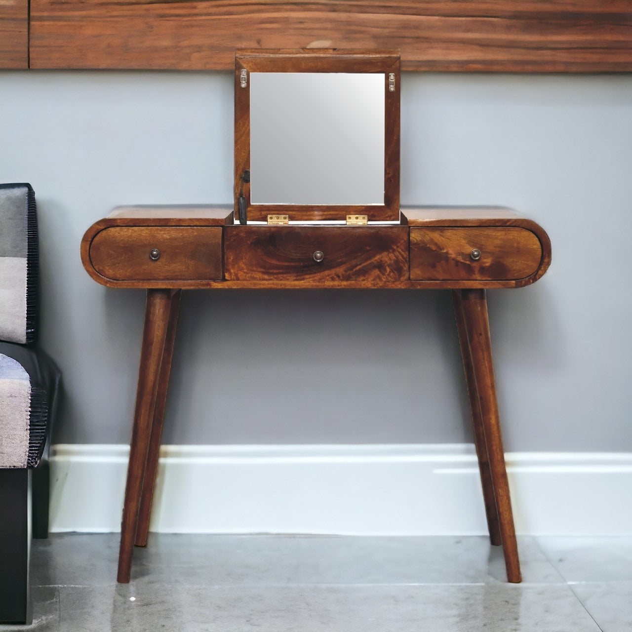 A sleek chestnut mirror vanity table in dark wood with a rectangular mirror and three drawers with round metal knobs
