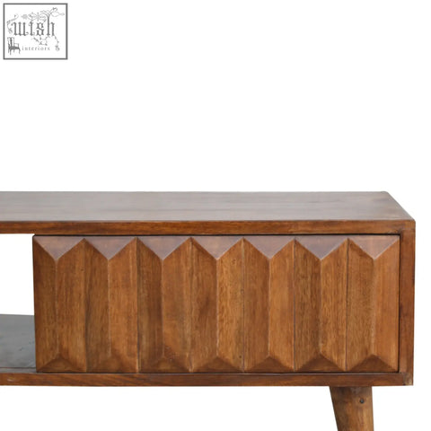 A mid-century modern chestnut prism sliding chest of drawers with a geometric solid mango wood faceted front panel and tapered legs