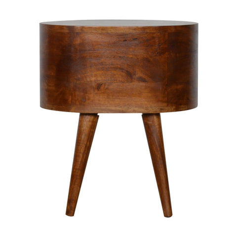 A chestnut rounded bedside table with a sleek cylindrical wooden design and warm chestnut finish on three tapered legs