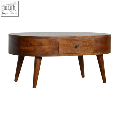 A sleek chestnut rounded coffee table with warm brown solid mango wood and tapered legs for stylish living spaces