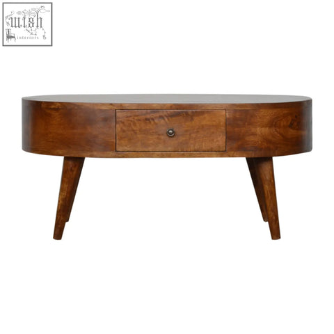 Chestnut rounded coffee table with solid mango wood, warm brown finish, and sleek tapered legs for living room use