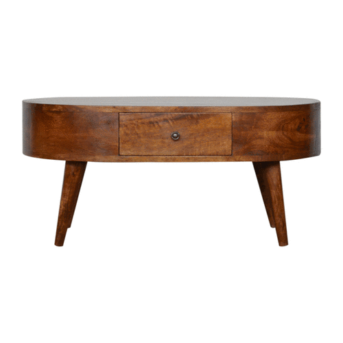 Warm-toned chestnut rounded coffee table with a central drawer and tapered solid mango wood legs