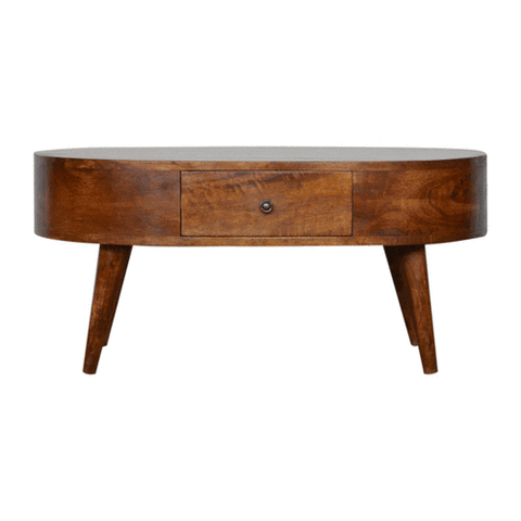 Warm-toned chestnut rounded coffee table with a central drawer and tapered solid mango wood legs