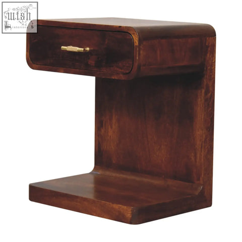 Dark brown mango wood rounded bedside table with a single drawer and brass handle for bedroom storage