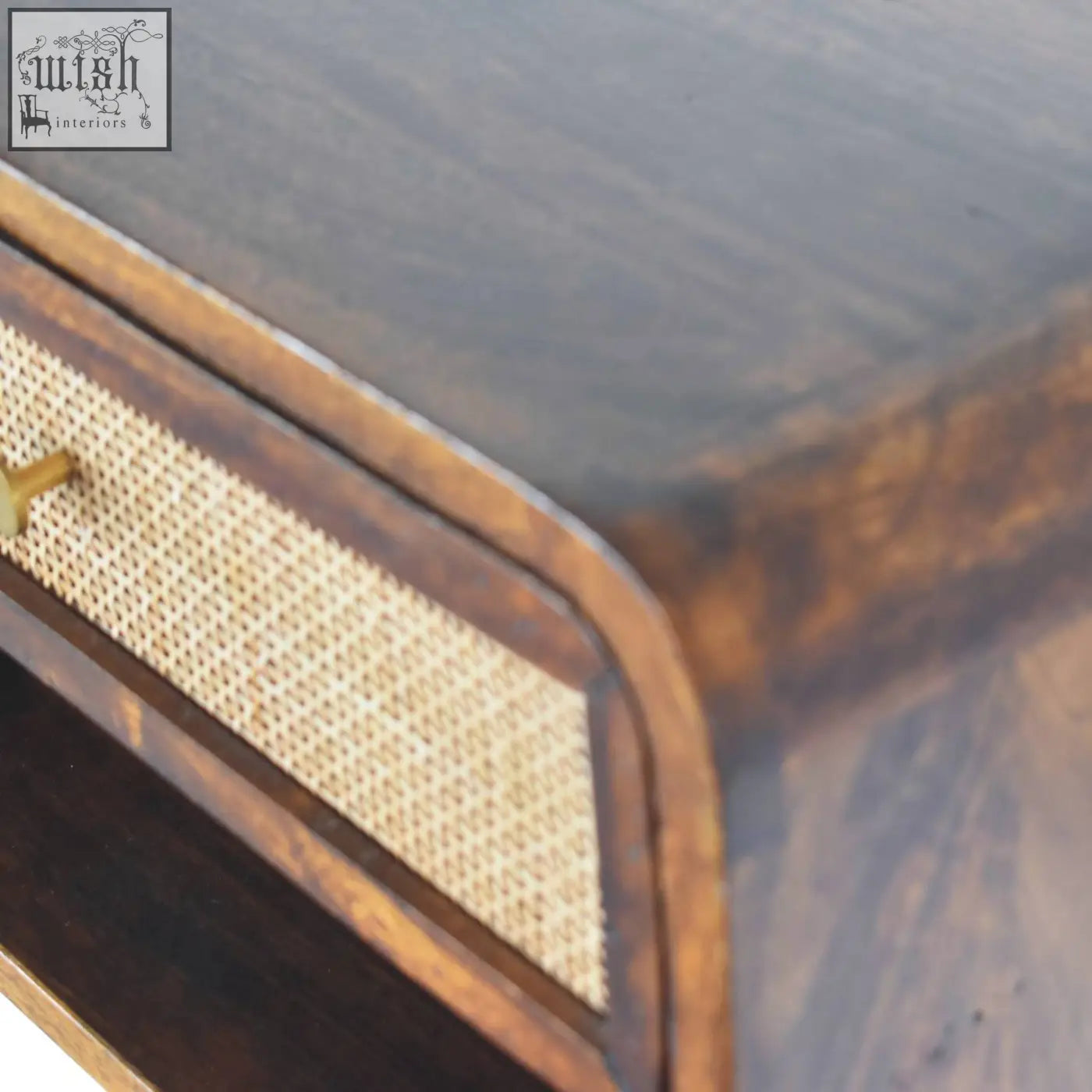 Dark wood wall mounted bedside table with woven cane drawer front and brass handle made of solid mango wood