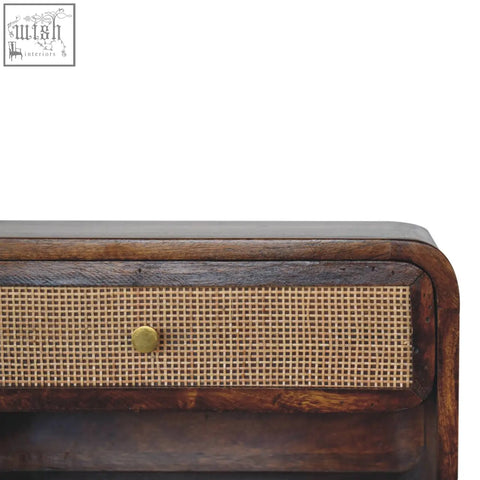 Dark wood wall mounted bedside table with woven cane front and brass knob made of solid mango wood