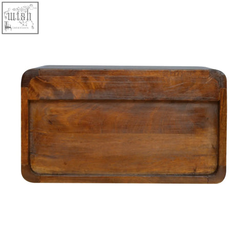 Rectangular wall-mounted bedside table in warm brown solid mango wood with visible wood grain and open woven design