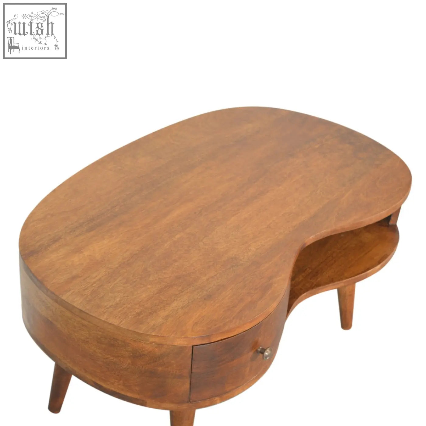 Chestnut wave coffee table with warm brown solid mango wood finish, oval shape, tapered legs, and lower shelf