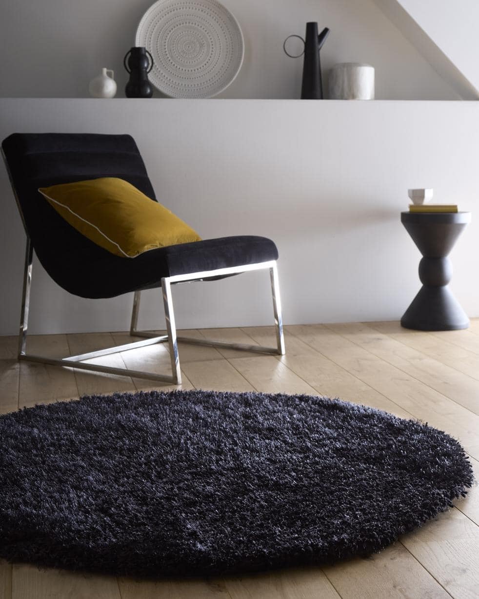 Dark gray plush circular chicago black shaggy rug with shaggy texture perfect for cozy living spaces