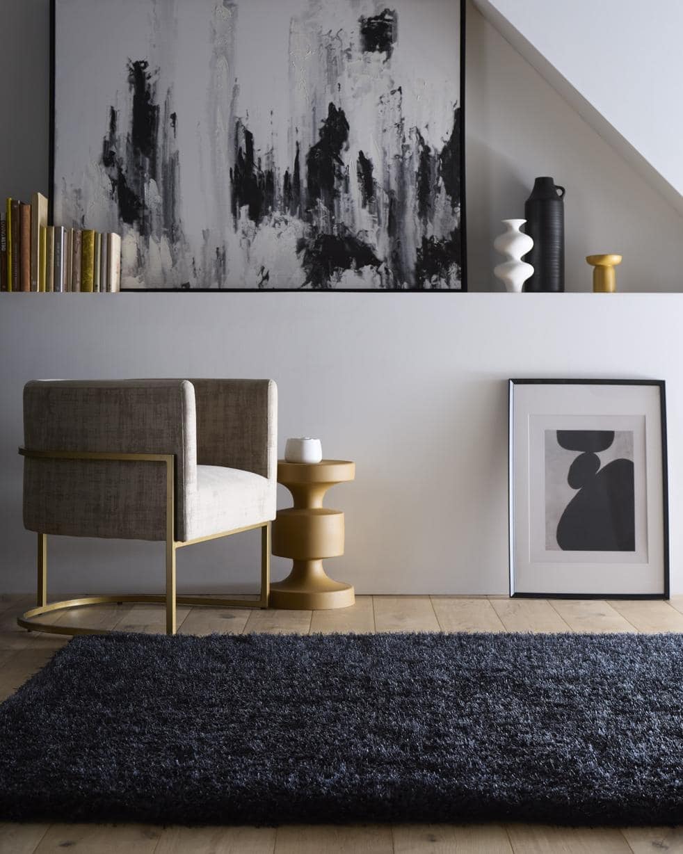A plush chicago black shaggy rug in dark navy blue with a dense textured pile for cozy spaces