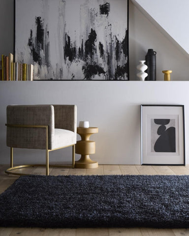A plush chicago black shaggy rug in dark navy blue with a dense textured pile for cozy spaces