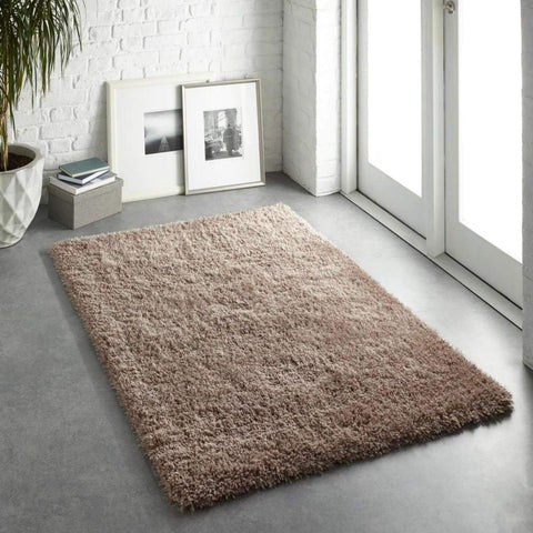 A plush beige chicago latte shaggy rug with a soft textured surface perfect for cozy living spaces