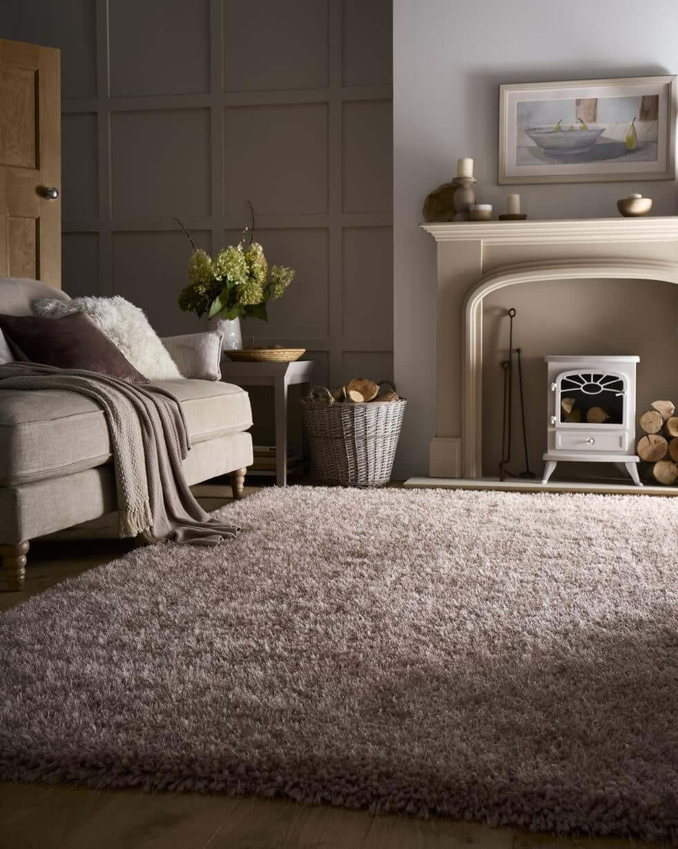 A plush soft textured gray chicago latte shaggy rug with a mottled tone and fringed edges perfect for cozy spaces