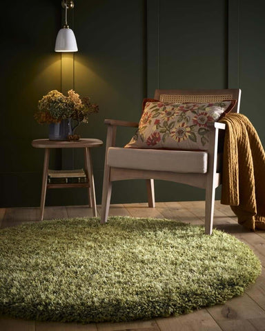 A plush round chicago olive green shaggy rug with a soft textured surface perfect for cozy spaces