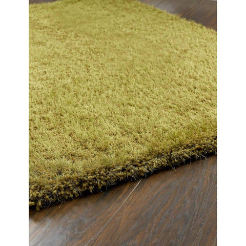 A plush chicago olive green shaggy rug with dense textured pile and fringed edges perfect for cozy spaces