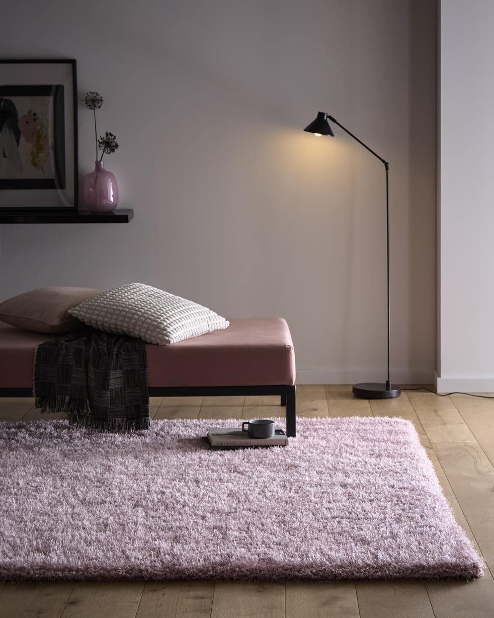 A plush chicago pink shaggy rug in light purple with a soft textured surface for cozy home decor