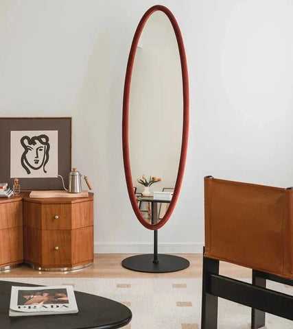 Tall oval chinatsu mirror with rich red frame and black stand perfect for stylish home decor