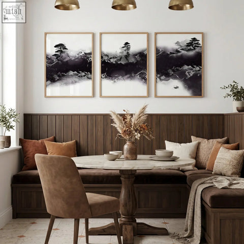 Round marble-top dining room table with dark wood pedestal base next to chinese artwork three prints wall art set