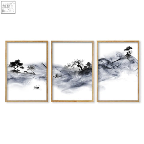Set of three black and white ink wash landscape prints featuring fisherman and pagoda in light wood frames