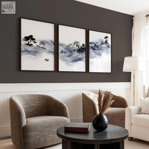 Black matte ceramic vase holding dried pampas grass next to ink wash landscape chinese artwork prints set of 3