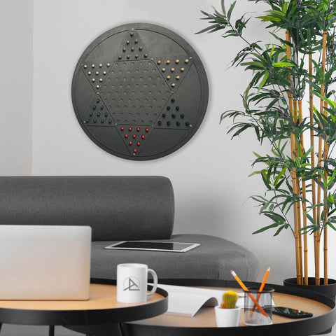 Black circular chinese checkers wall game with star-shaped opposite triangle grid and colorful pegs for decoration