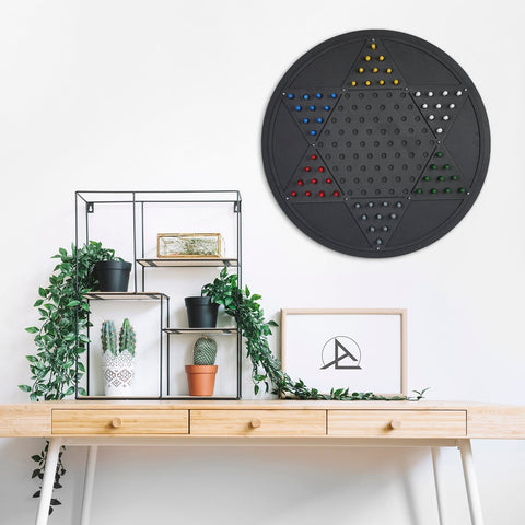 Black circular chinese checkers wall game with star-shaped opposite triangle grid and colorful pegs for fun play