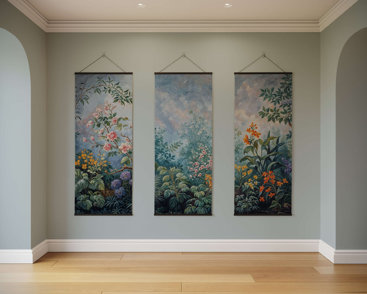 Three hanging chinoiserie floral garden tapestries with vibrant pink orange and green floral designs on blue gray fabric