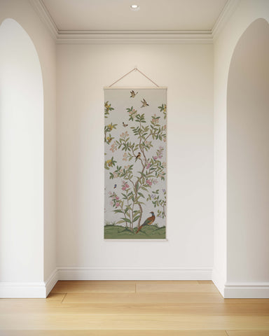 A delicate chinoiserie tree tapestry with birds butterflies and flowering vines on soft off-white fabric background