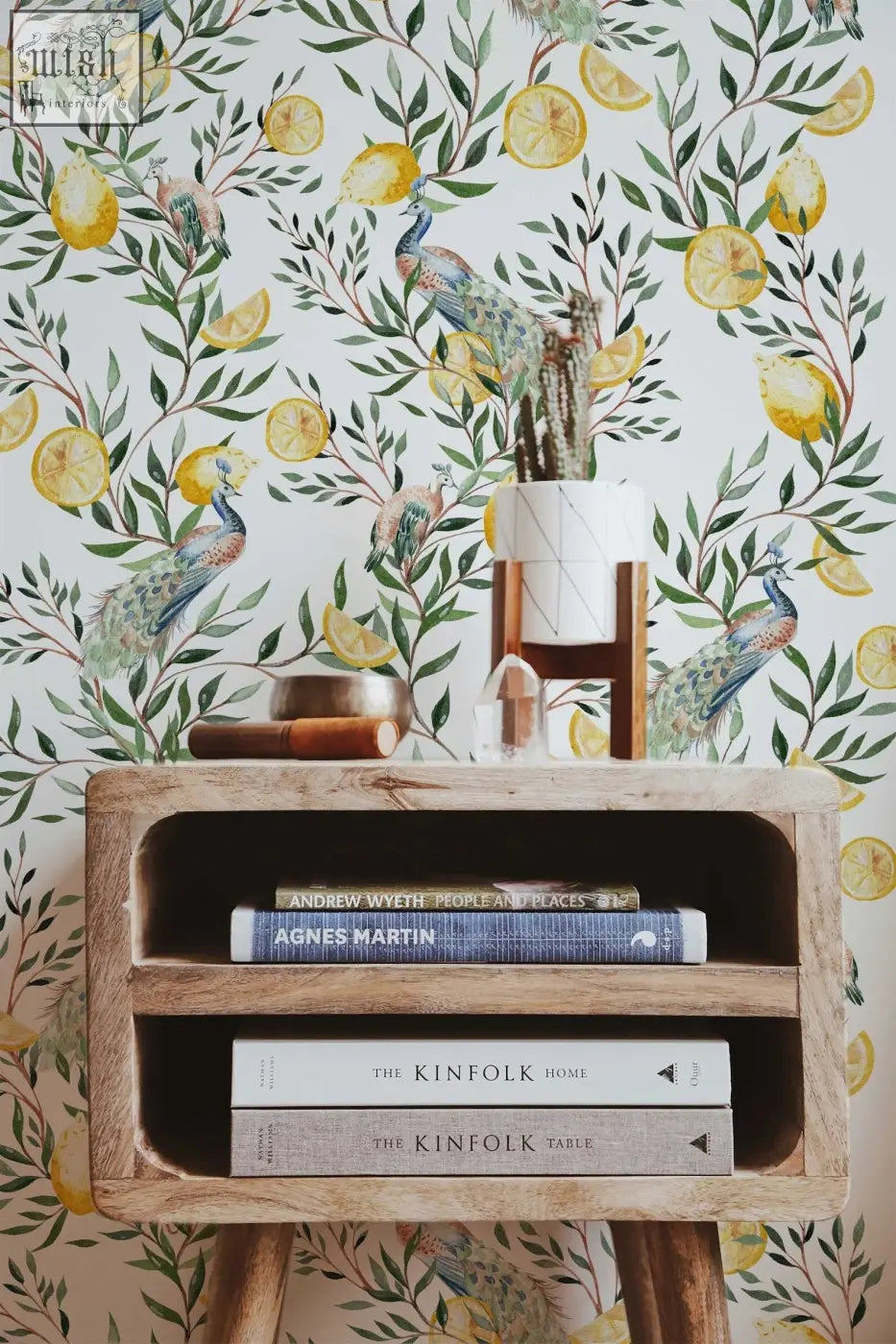 A rustic wooden shelf with books and a small potted cactus complements traditional paper living space by contact clickwalls