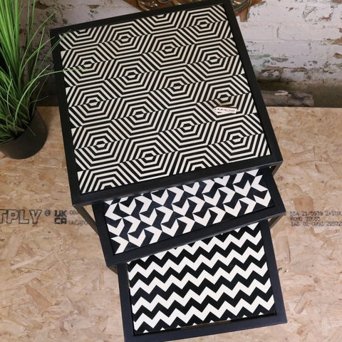 Chinta modern black square nesting side tables with resin tabletops featuring bold white geometric patterns