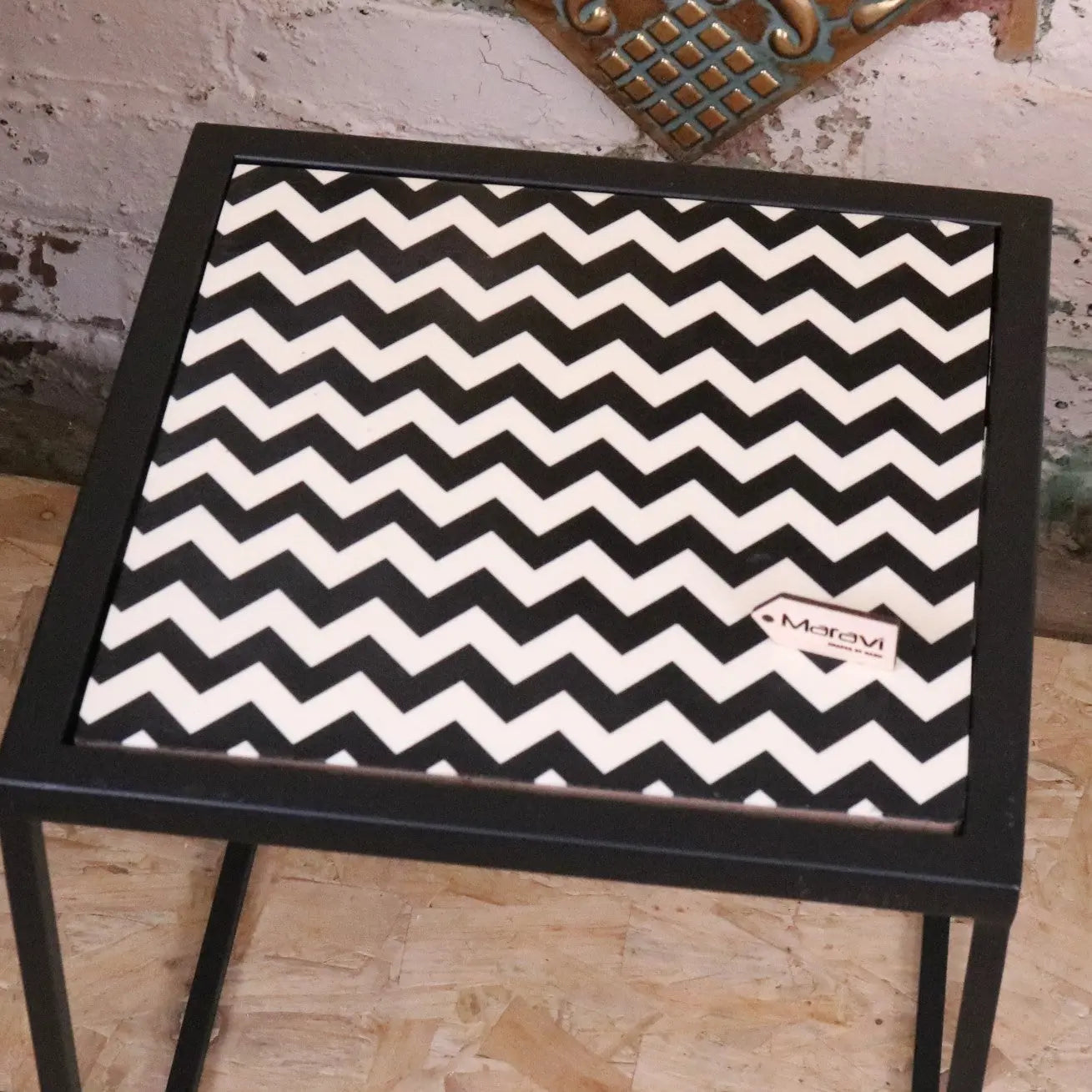 Chinta modern black square nesting side tables with metal frame and bold black and white resin tabletops