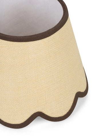 Beige linen lampshade with scalloped edge and dark brown trim made of brown jute for a warm cozy look