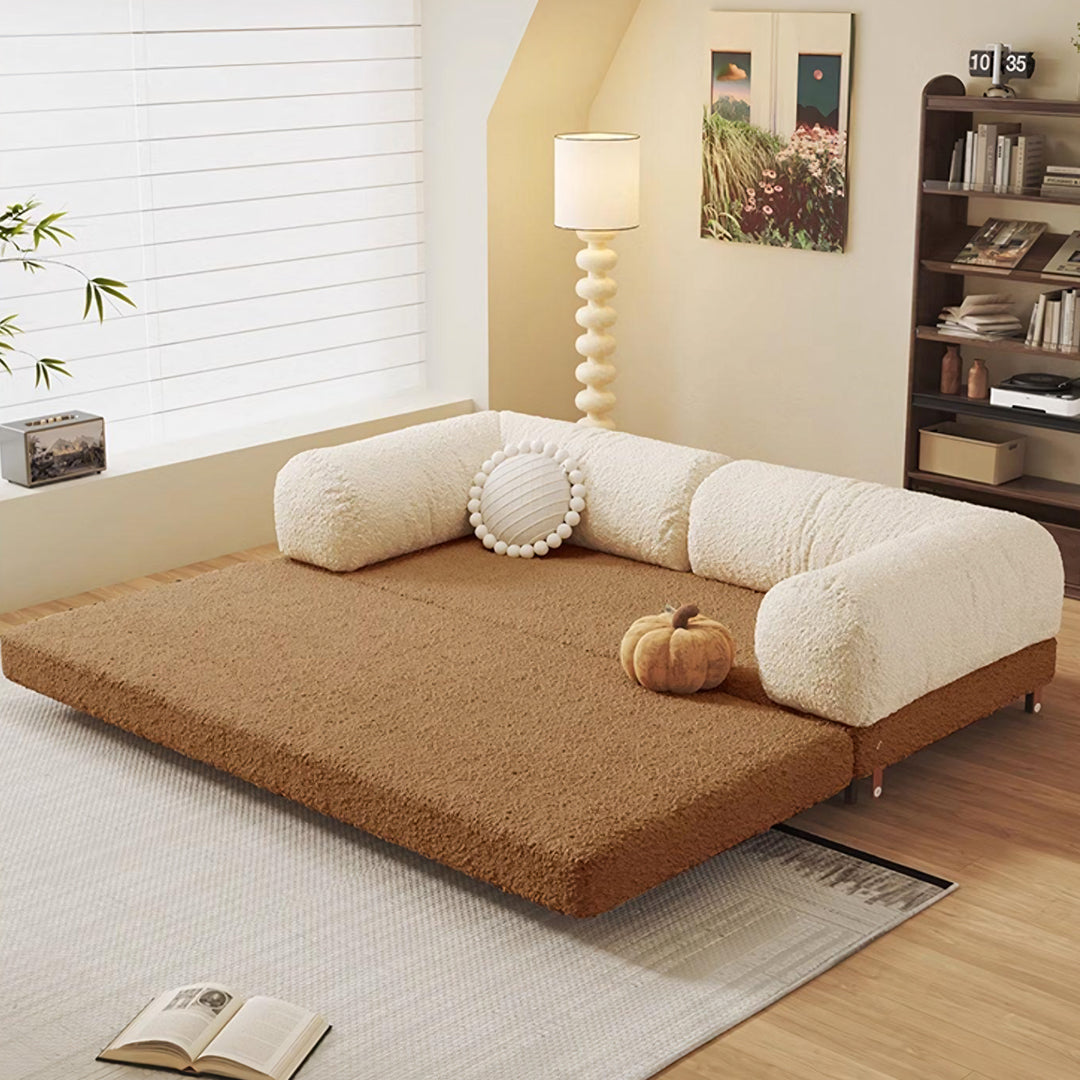 Cream-colored plush faux fur two seater sofa bed with brown corduroy mattress base and rounded armrests choudhury