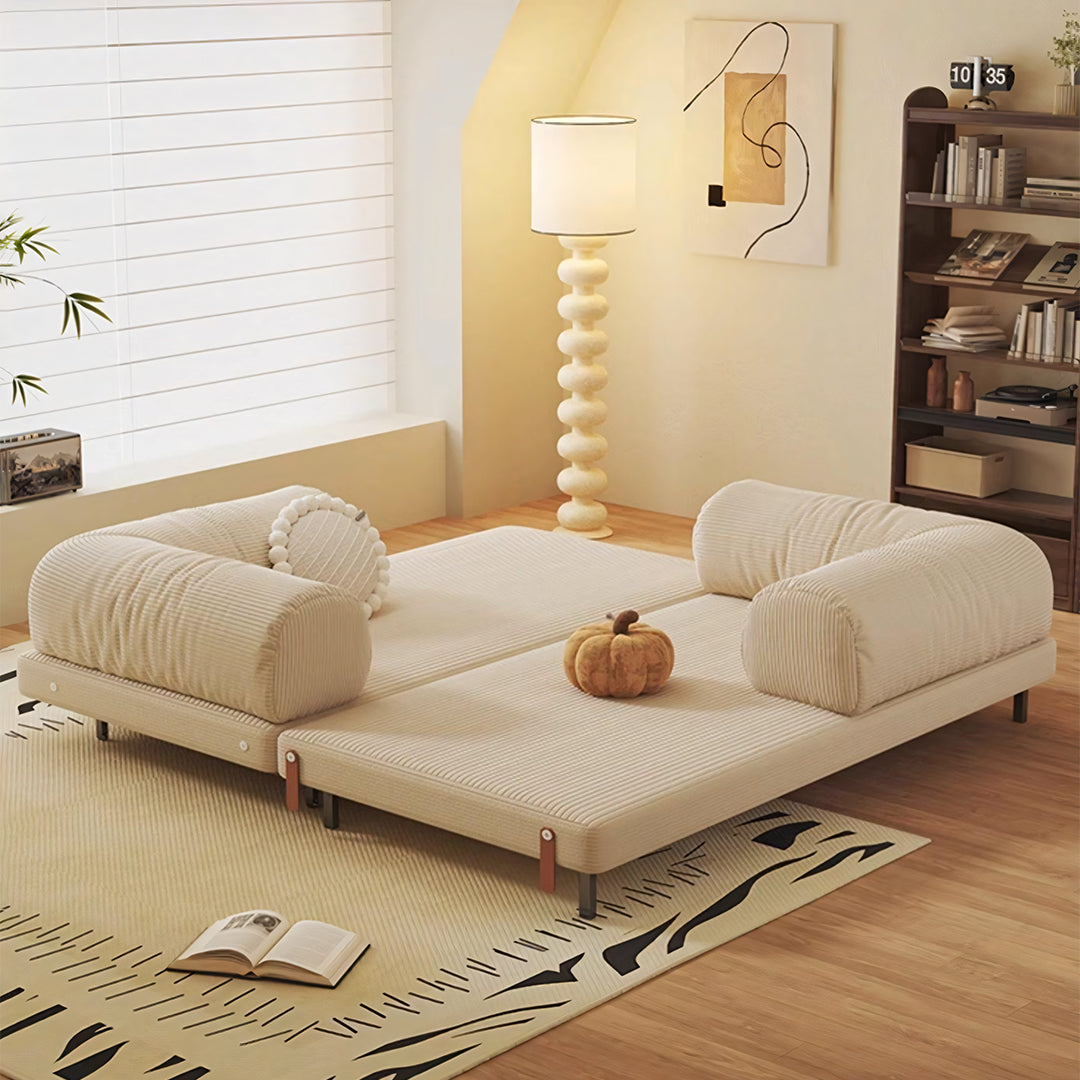 Cream-colored corduroy choudhury two seater sofa bed with plush rounded armrests and washable backrest