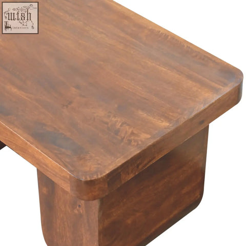 Chunky chestnut coffee table with a rustic brown wooden top and rounded edges perfect for your living room