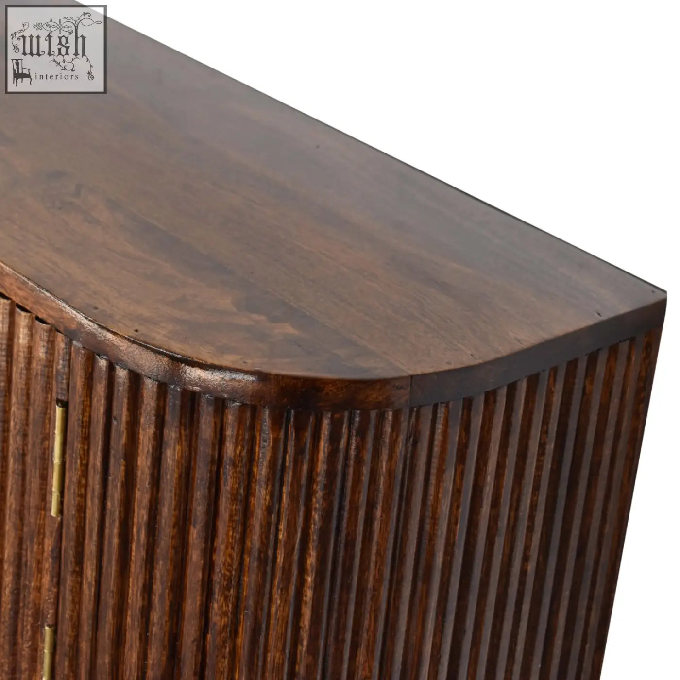 Chunky chestnut wall mounted console chest of drawers in dark brown mango wood with vertical ribbed paneling and curved top edge