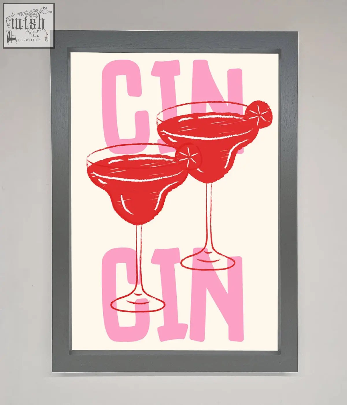 A cin cin framed print showing two red gin cocktails with pink lettering in a stylish framed art print