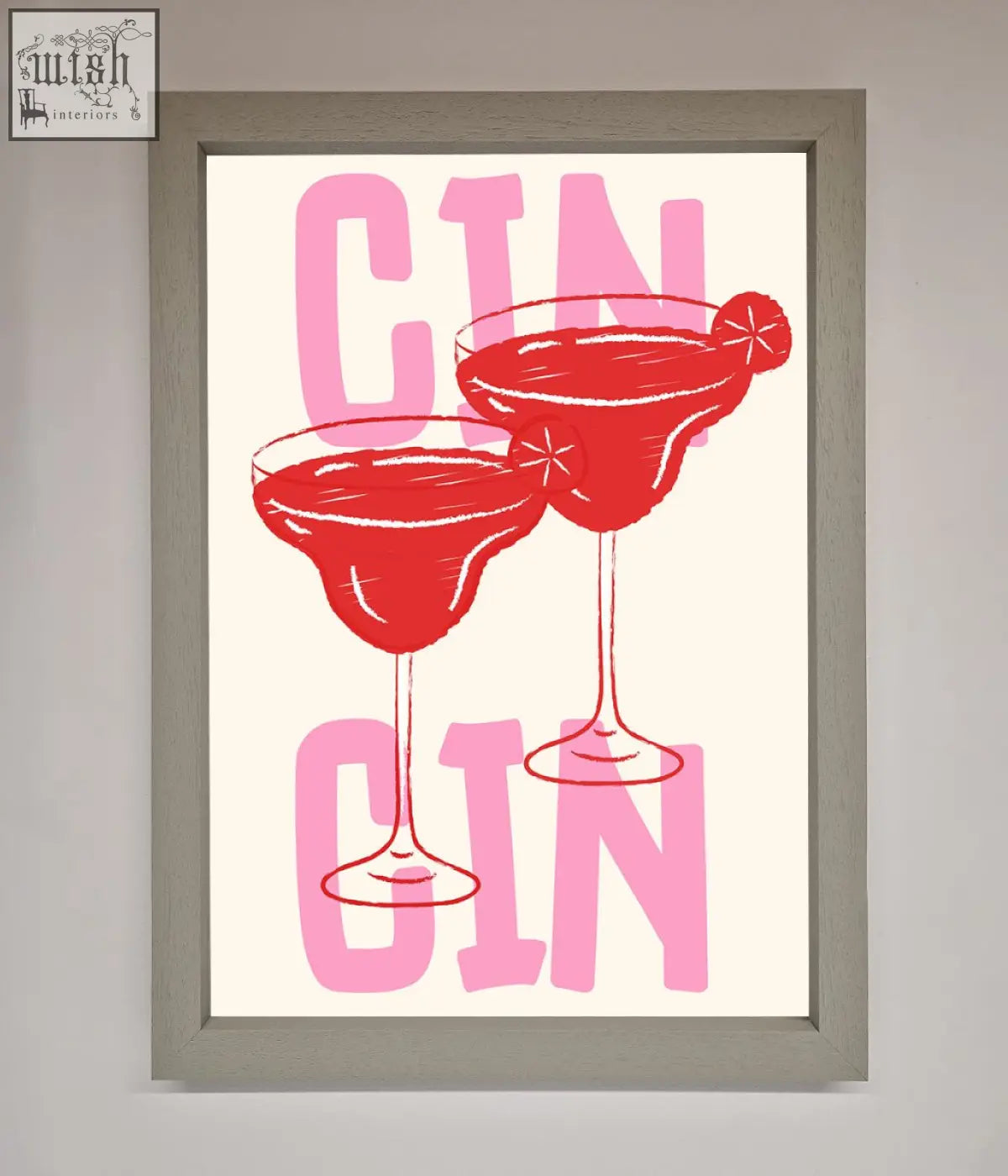 A cin cin framed print showing two red gin cocktails with pink lettering in a stylish art print frame