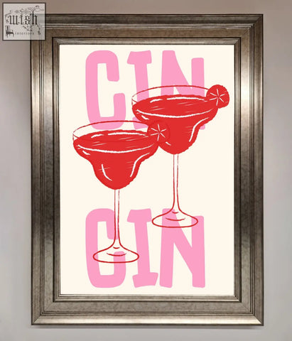A cin cin framed print featuring two red gin cocktails with pink gin lettering on a cream background