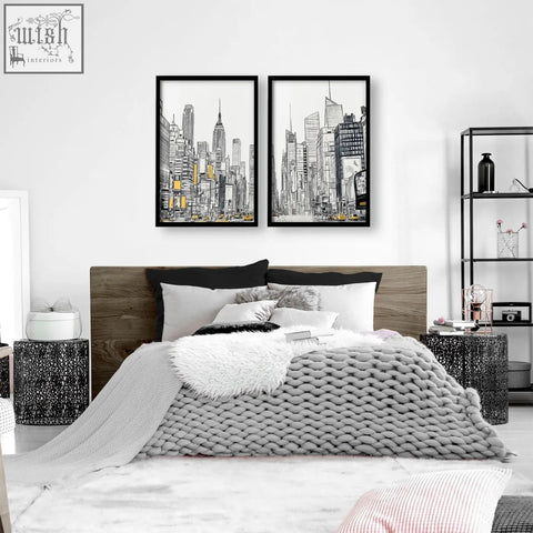 Black-framed city prints wall featuring minimalist urban skyscrapers line art with selective yellow accents in prints wall art set
