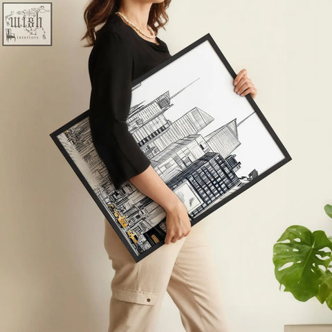 Black-framed city prints wall art set with intricate line drawings and subtle yellow accents on white background