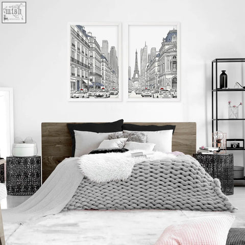Gray chunky knit throw blanket with cable knit pattern draped on bed in a city wall art paris street scenes setting