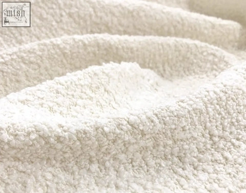 Cream-colored claire armchair with plush boucle faux fur fabric offering financing and low shipping cost options
