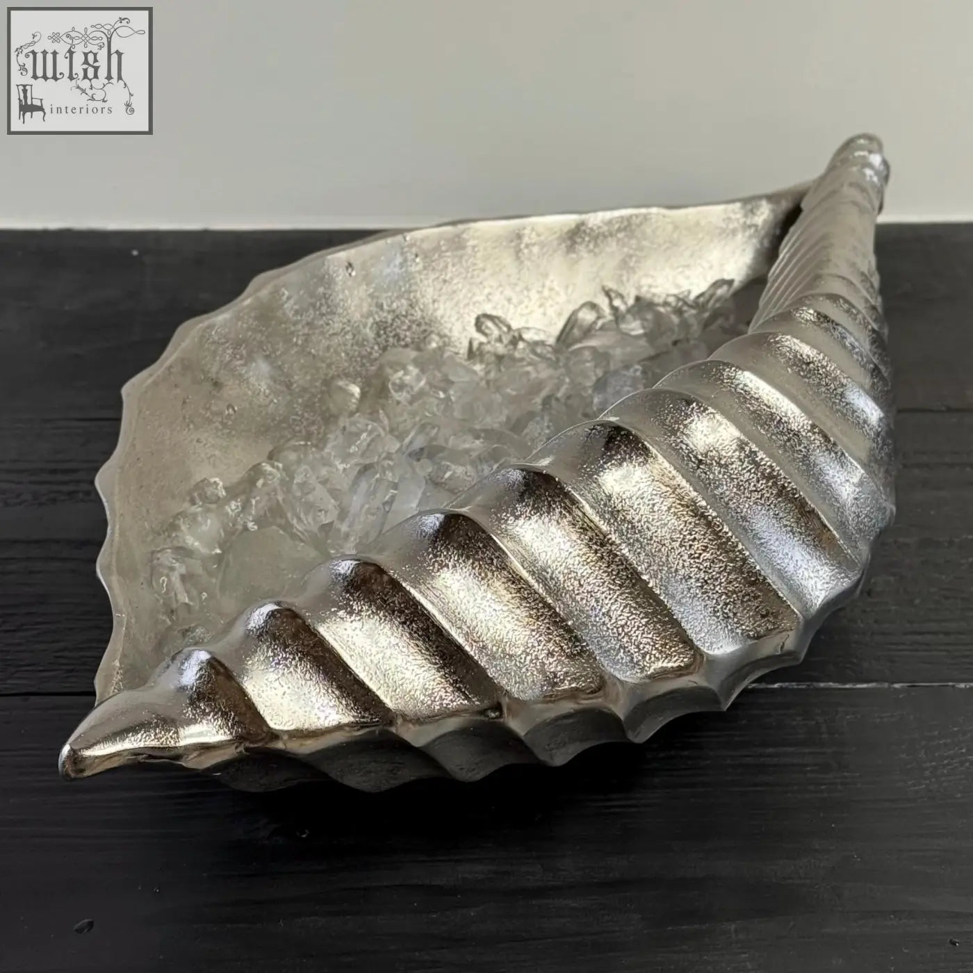 Silver textured clam shell ice bucket with ridged spiral design perfect as a champagne ice bucket and wine cooler