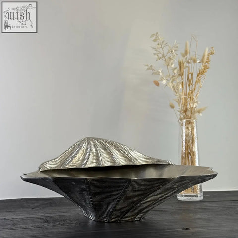 Silver metallic clamshell ice bucket with textured ridges and hinged lid perfect as a champagne wine cooler