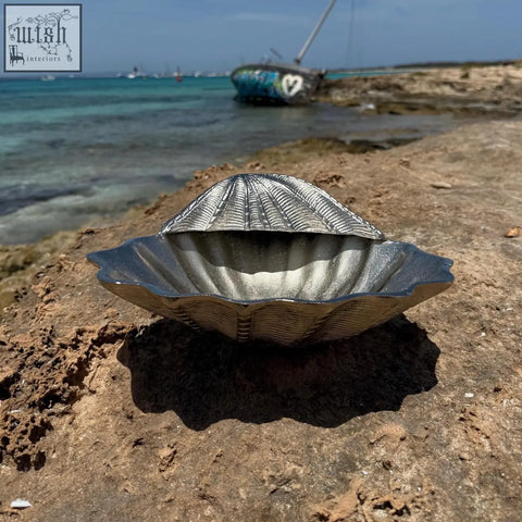 Silver metallic clamshell solid champagne ice bucket with ridged texture and scalloped edges for wine cooling